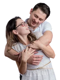 Happy young couple embracing, representing improved sexual health and vitality